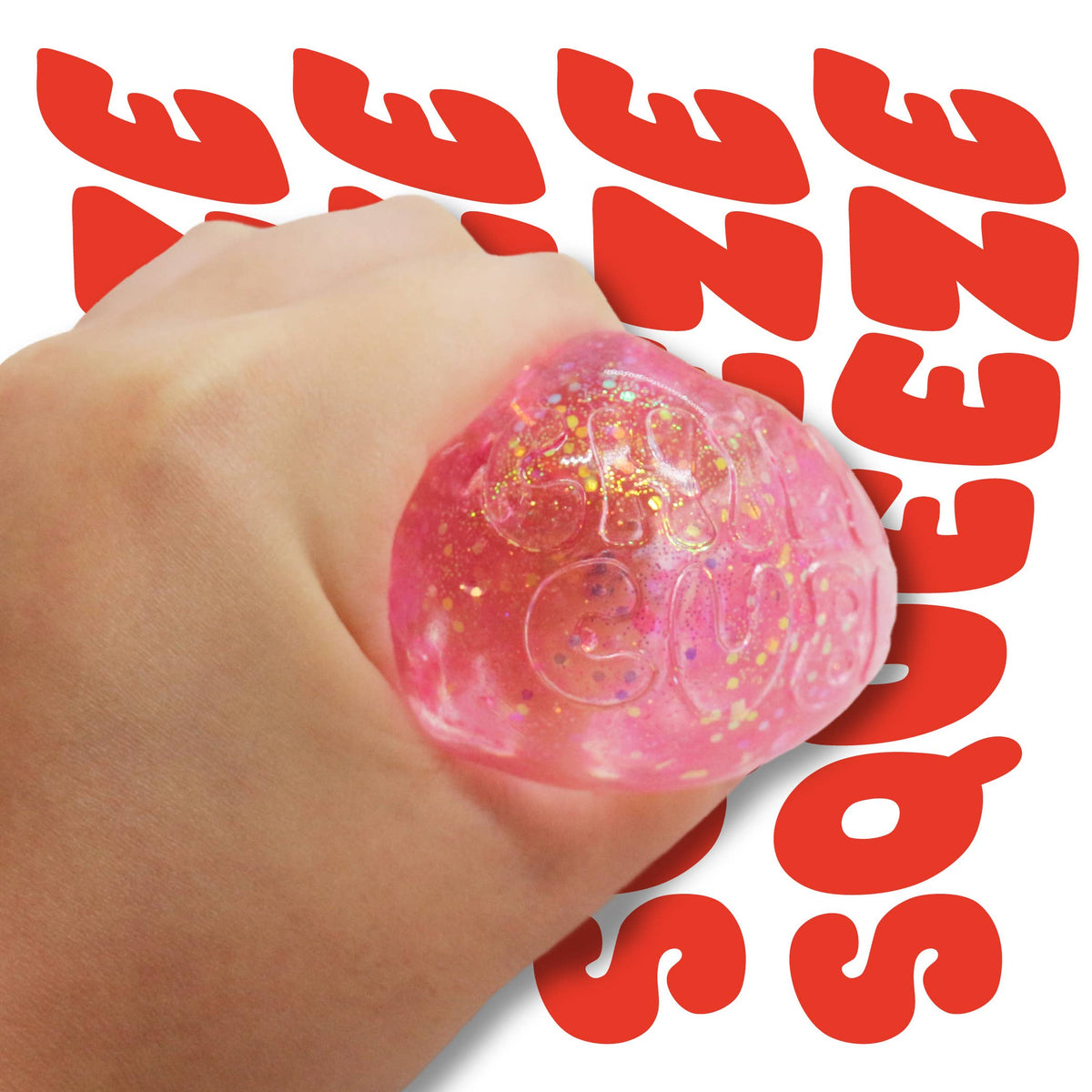 Pink glittery stress ball held in a hand with 'SQUEEZE' text in the background