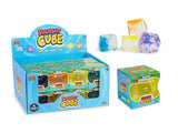 Play Hub Squishy Cube display box beside individual boxed cubes and four loose glitter cubes