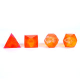 Set of four geometric-shaped orange squishies on a white background