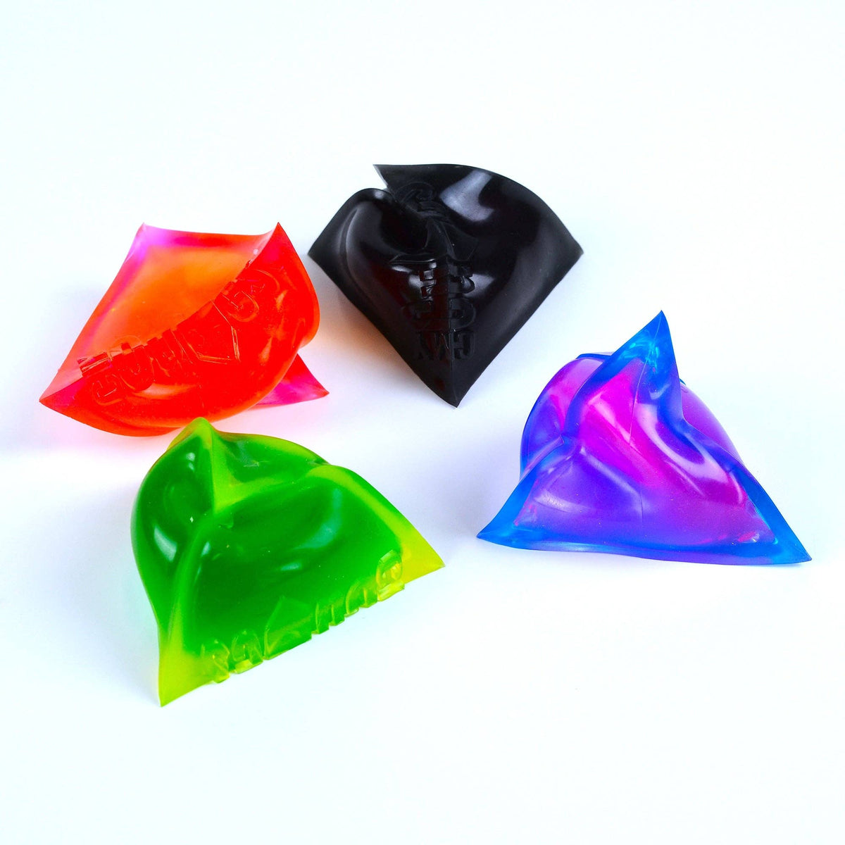Four colorful triangular squishies on a white background