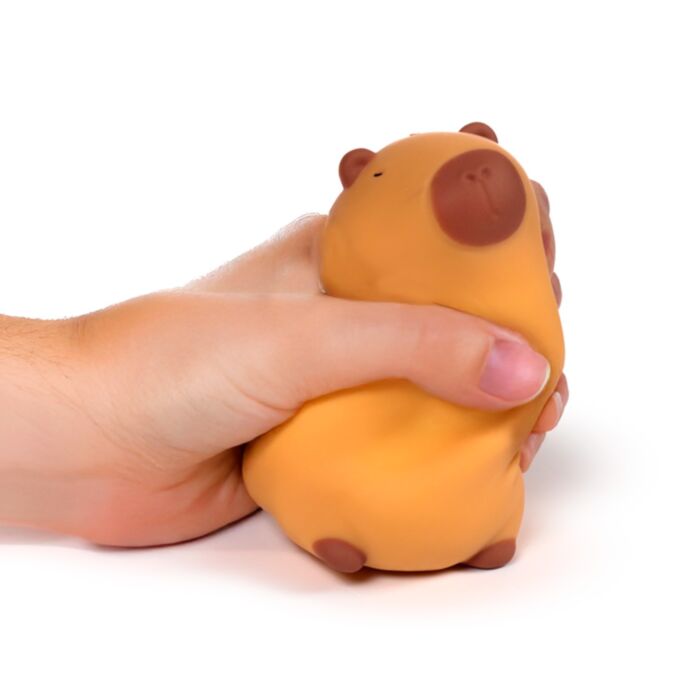 Puckator Stretchies Capybara orange sensory stretch toy squeezed in hand