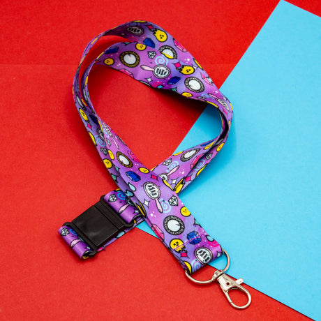 purple lanyard with colourful smiley diamonds clocks and hearts pattern with clasp