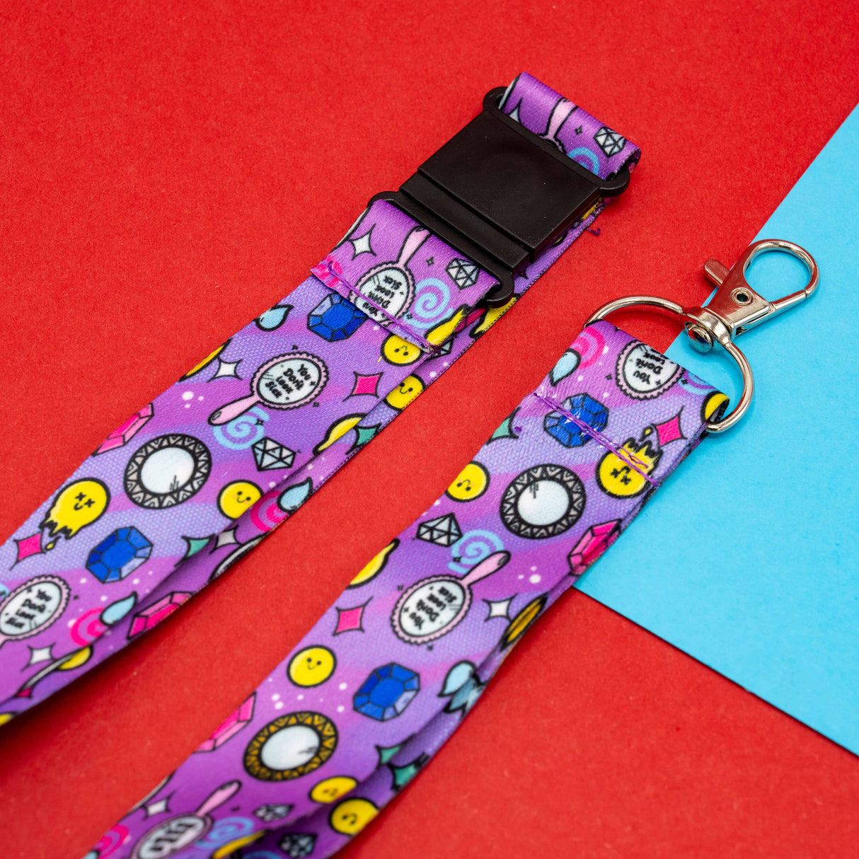 purple lanyard with smiley faces gems stars and motivational icons with clasp