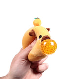 Queasy Squeezies Adoramals capybara squeezy toy, orange bead ball from mouth
