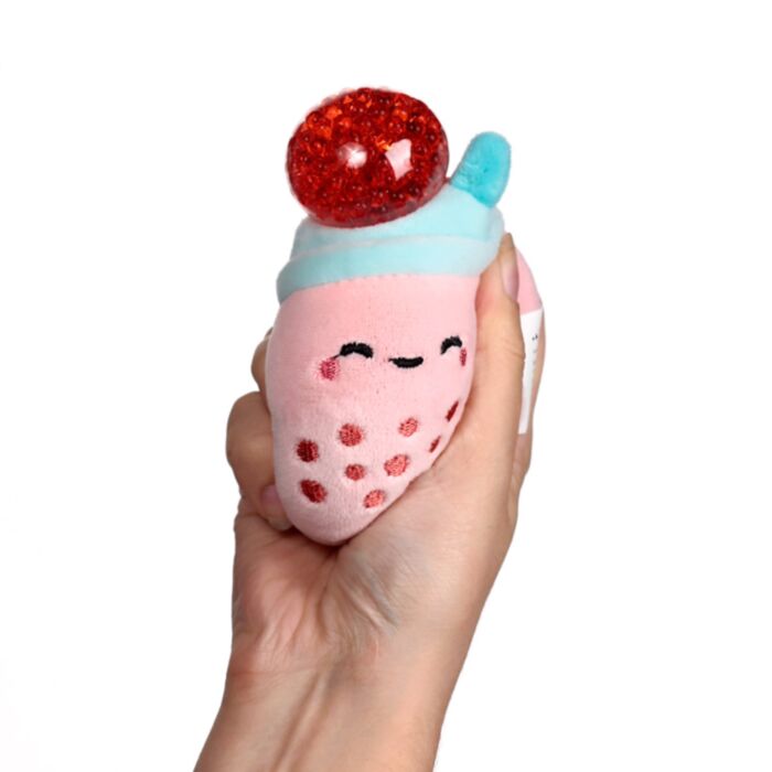 Pink Queasy Squeezies bubble tea plush — red bead stress ball pops out on squeeze