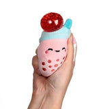 Pink Queasy Squeezies bubble tea plush — red bead stress ball pops out on squeeze