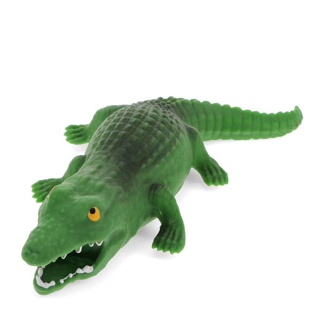 Green toy crocodile on a white background