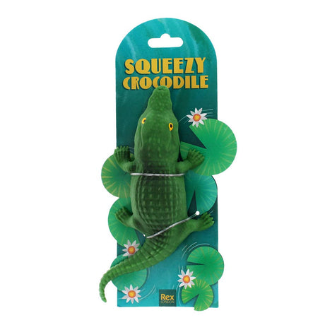 Green crocodile toy with packaging labeled 'Squeezy Crocodile' on a white background