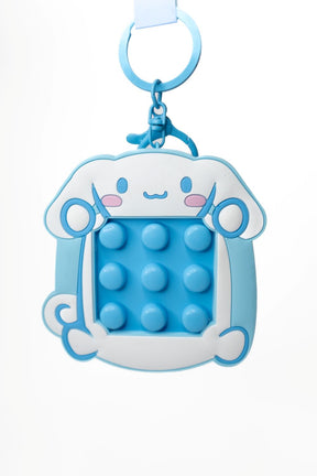 Front of Sanrio Cinnamoroll fidget keychain showing blue bubble pop fidget pad