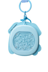 Back of Sanrio Cinnamoroll fidget keychain showing blue ball maze puzzle game