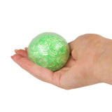 Green Scrunchems ASMR Crunch Ball crunchy sensory fidget toy held in hand