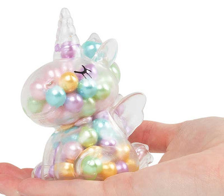 Scrunchems ASMR Rainbow Unicorn bead-filled squishy unicorn resting in open hand showing size and detail.