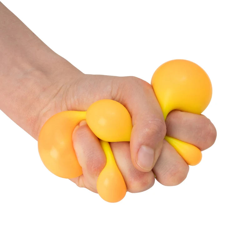 Hand squeezing Scrunchems Colour Change Squish Ball as it shifts from yellow to orange