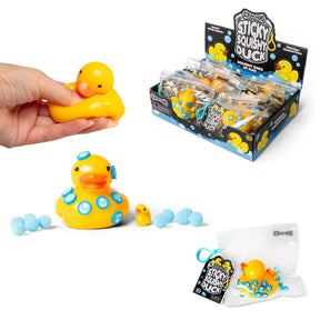 Scrunchems Sticky Squishy Duck shown being squeezed alongside decorated duck, accessories, resealable bag, and retail display box