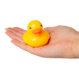 Plain yellow Scrunchems squishy duck without accessories resting on an open palm
