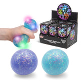 Scrunchems Galaxy Light Up Squish Ball packaging, display box and both blue and purple colourways together