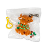 Scrunchems Sticky Squishy Highland Cow in sealed bag with sticky pom-pom balls and yellow clip hanger