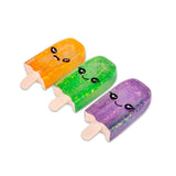 Three Scrunchems glitter ice lolly squishies in orange, green and purple arranged together on white background