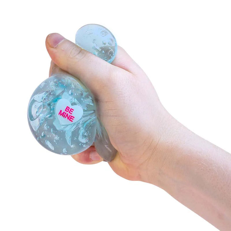 Blue Scrunchems Kind Heart Squish Bear being squeezed to reveal Be Mine heart message