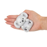 Grey Scrunchems Sticky Squishy Koala resting flat on an open palm showing squishy ears and body