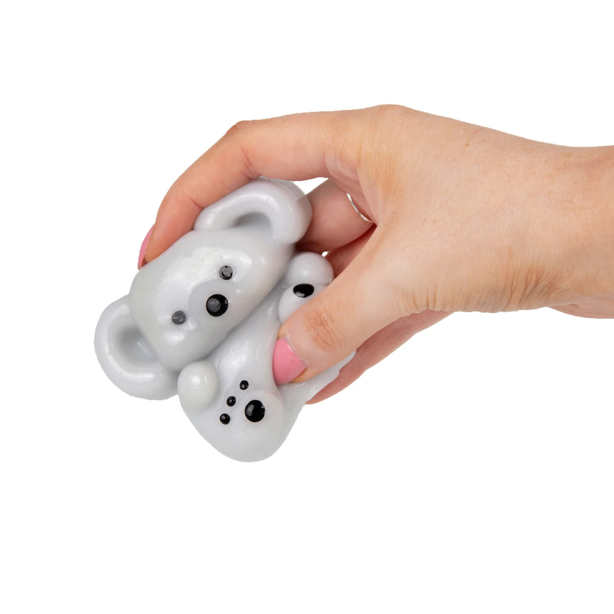 Hand squeezing and deforming the grey Scrunchems Koala squishy toy