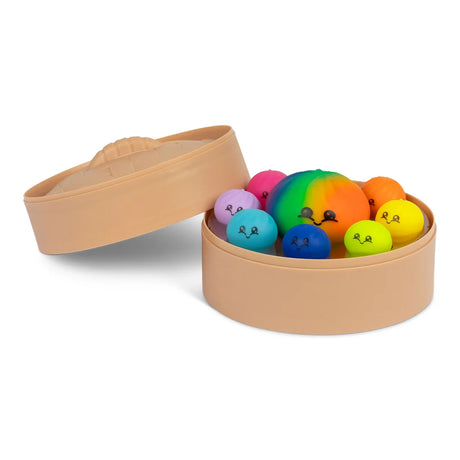 Angled view of an open Scrunchems steamer box filled with nine kawaii dumpling squishy toys