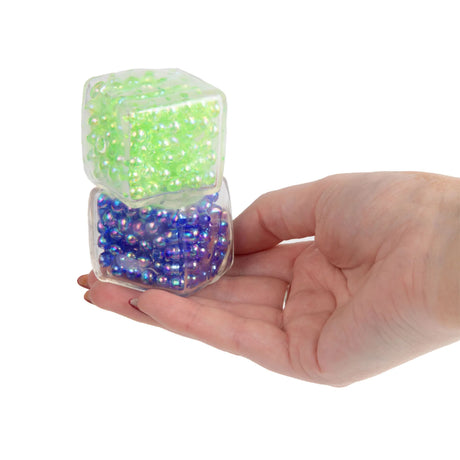 Scrunchems Mini ASMR Crunch Cubes stacked in hand, bead-filled sensory fidget toy