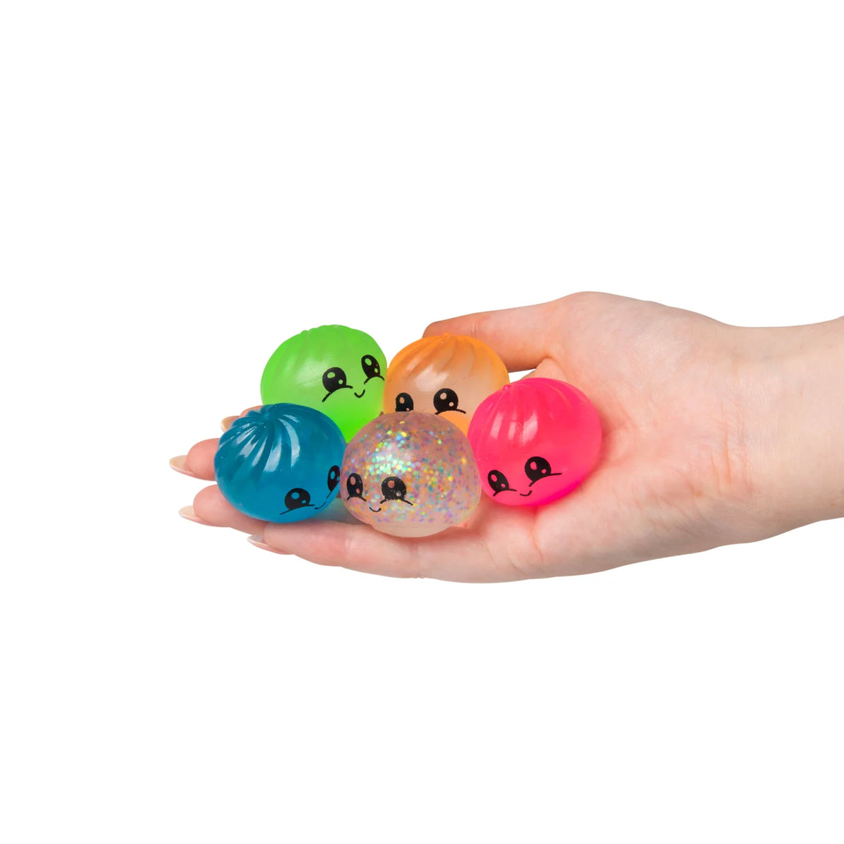 Five Scrunchems Mini Sugar Dumpling kawaii squishy fidget toys held in hand