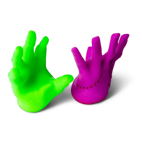 Neon green and hot pink Monster Hands displayed upright side by side showing palm and stitching detail