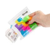 Hand squeezing a resealable Scrunchems bag filled with colourful squishy puzzle cube pieces