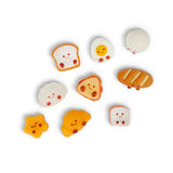 Nine kawaii bakery squishy characters including toast, egg, croissant and bread laid flat