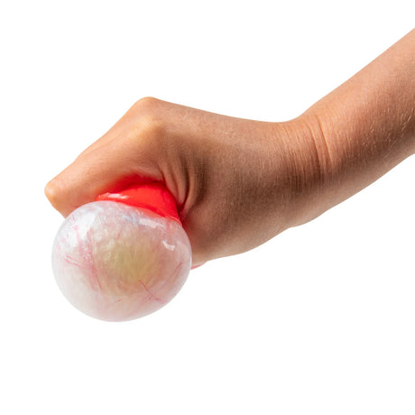Adult hand squeezing a red squishy eyeball ball, with a glowing veined eyeball bulging out from the top