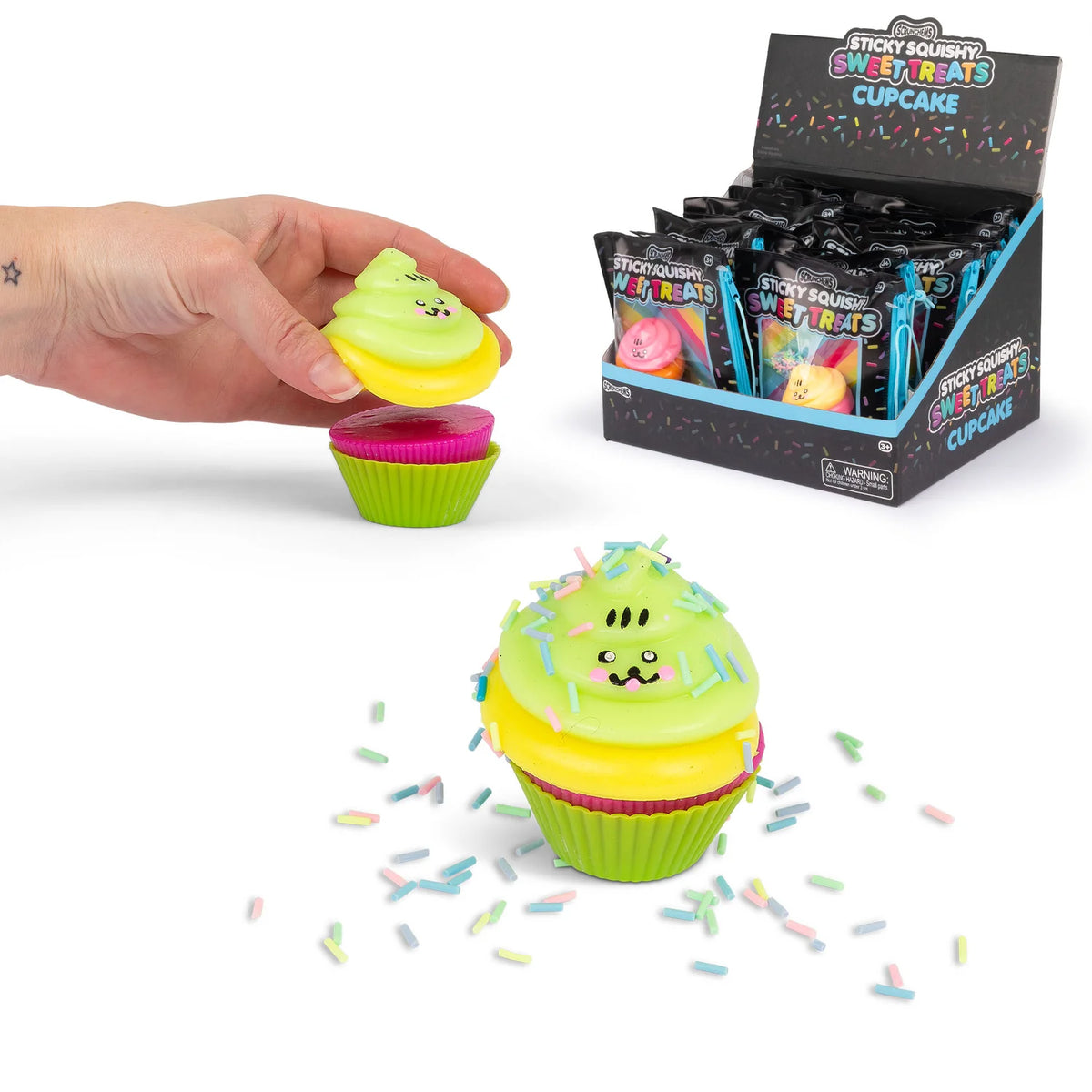 Scrunchems Sticky Squishy Cupcake being stacked and decorated beside retail counter display box