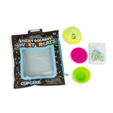 Scrunchems Sticky Squishy Cupcake pouch beside kawaii icing, pink sticky bun, green case and sprinkles