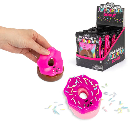 Scrunchems Sticky Squishy Donuts in chocolate and pink beside retail counter display box