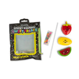 Scrunchems Sticky Squishy Fruit Stack pouch beside strawberry, mango, watermelon, straw and sprinkles