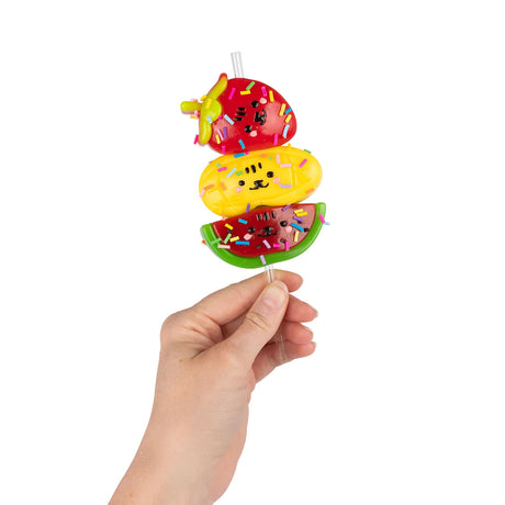 Hand holding Scrunchems Sticky Squishy Fruit Stack of strawberry, mango and watermelon with sprinkles