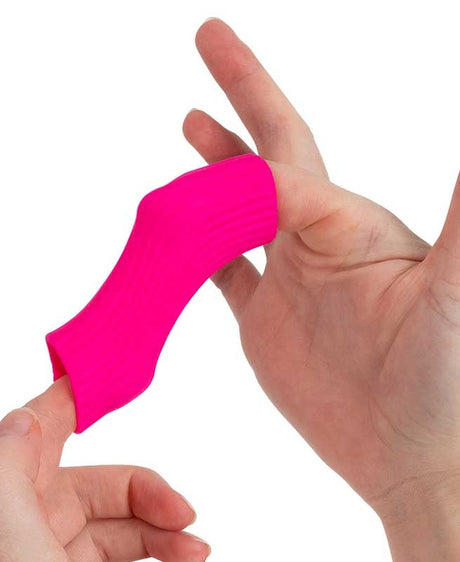 Hand stretching neon pink Scrunchems Stretchy Squeezy Pasta Shape penne showing super stretchy fidget toy.