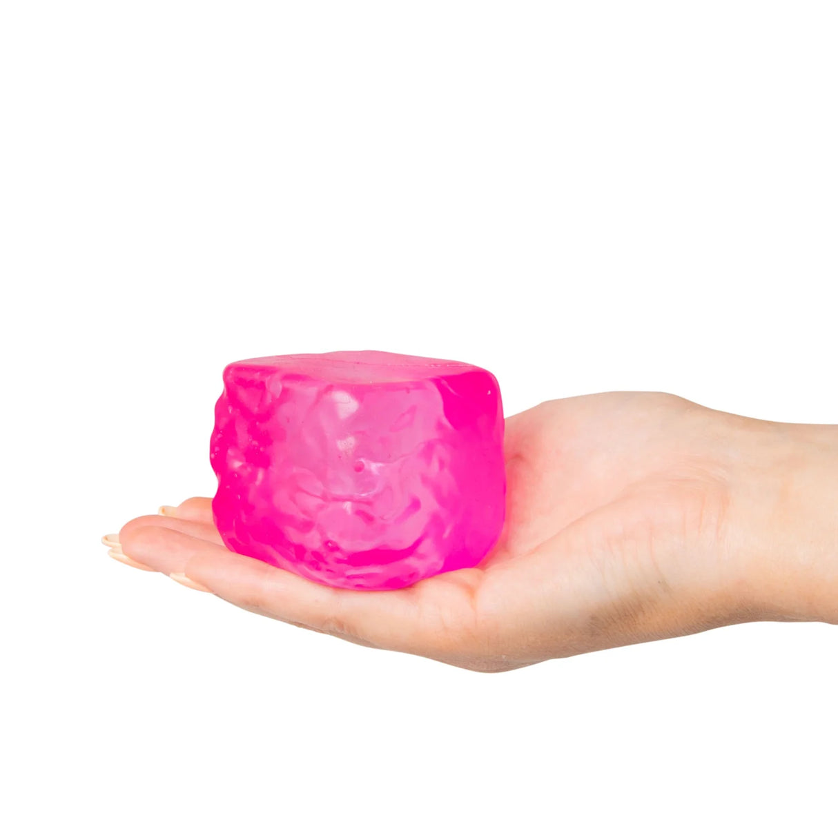 Pink Scrunchems Textured Sugar Cube resting on an open palm