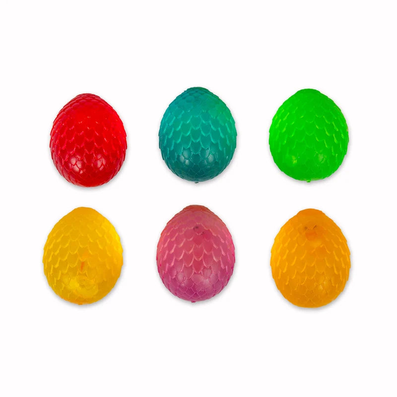 Six colourful Scrunchems Sugar Dragon Egg squishy balls arranged in a flat lay grid