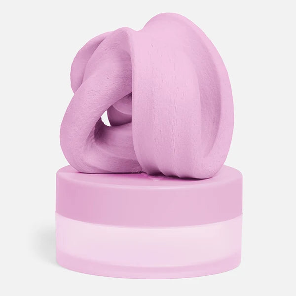 Blush pink focus putty folded on top of matching pastel pink storage jar