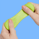 Citron green silicone putty being pulled and stretched between two hands