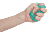 Fist squeezing a mint green Speks Gump tree squishy into a twist, stretchy sensory toy