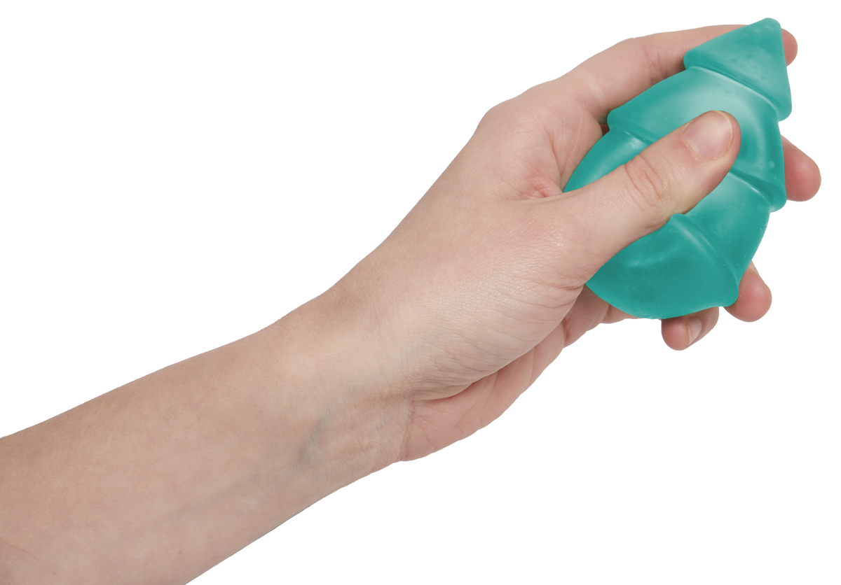 Hand holding a frosted green Speks Gump Christmas tree squishy, showing its palm-sized squeezable shape