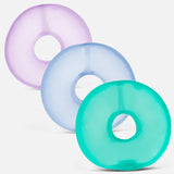 Three frosted Speks Gump Loop memory gel sensory toy rings in lilac, blue and teal