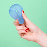 Dew blue Speks Gump Loop memory gel stress ring held in hand, fidget toy
