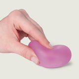 Hand squeezing and bending a pink Moon Jelly Speks Gump Original memory gel stress ball