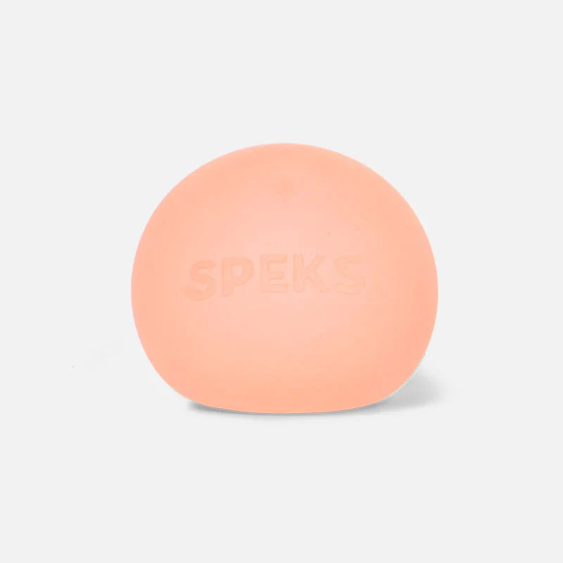 Single peach coral Speks Gump Original memory gel stress ball on a white background