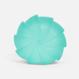 Speks Gump Surface stress ball in teal Sea Glass Edge colour, showing swirl surface texture