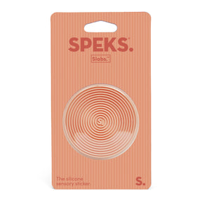 Speks slabs packaging with a circular design on an orange background